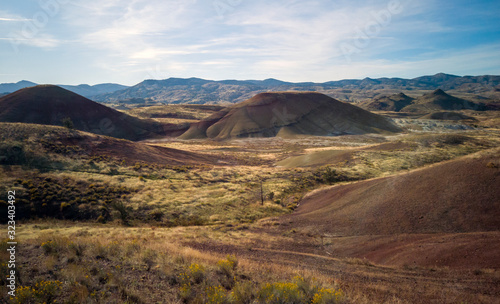 Breathtaking colorful John Day Fossil Beds Painted Hills with red green black orange and yellow stripes in a semi desert landscape in Oregon