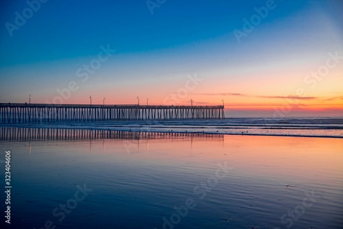 sunset over the wooden pier of Pismo Beach California © DD25