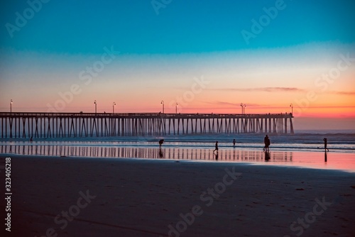 sunset over the wooden pier of Pismo Beach California