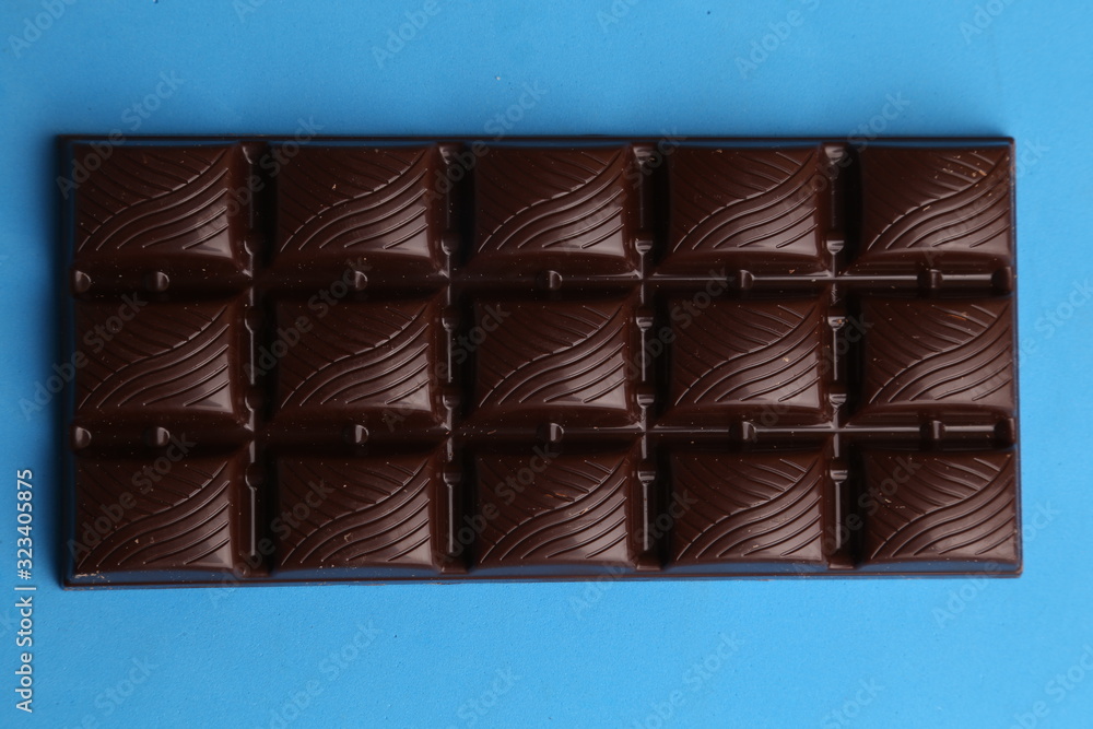 milk chocolate tablet in color background milk chocolate tablet in color background