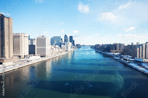 Frozen winter East river view from Roosevelt Island tramway in New York, NY, USA