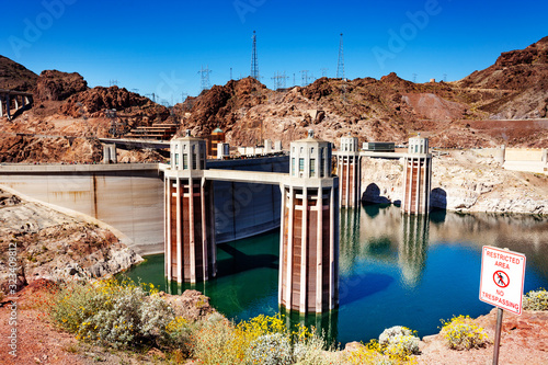 Water releasing towers of Hoover Dam made of concrete in the Black Canyon of the Colorado river on Nevada Arizona border