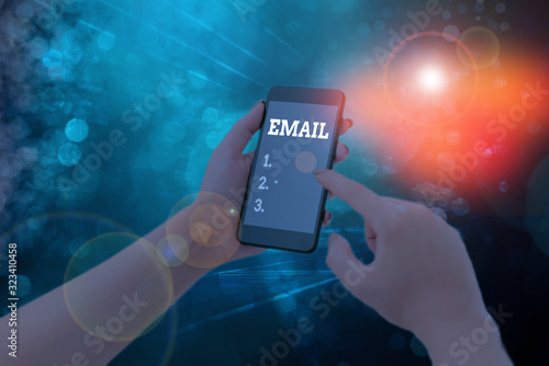 Conceptual hand writing showing Email. Concept meaning Sending a commercial message to a group of showing using mail photo