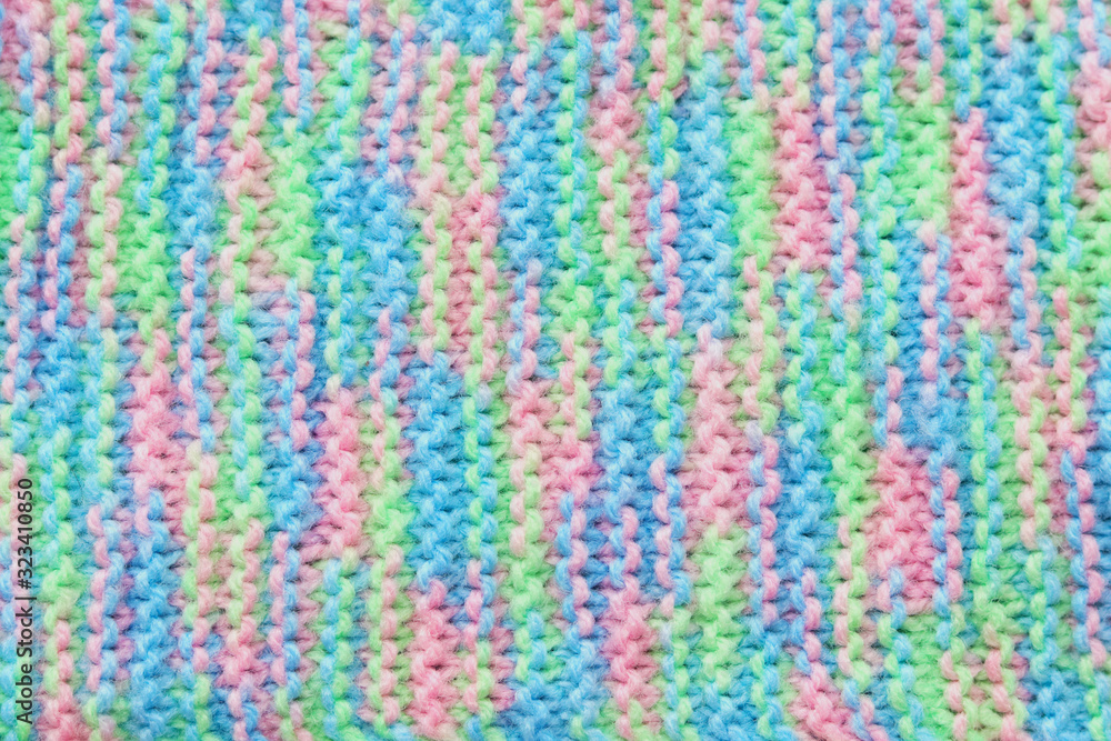 Textured knitted color background. Selective focus. Soft yarn. Handmade