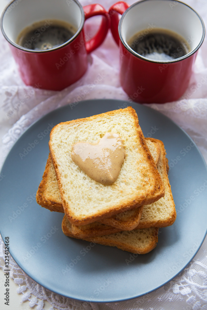 Delicious and healthy breakfast. Coffee, toast with peanut butter. Delicious and healthy breakfast. Coffee, toast with peanut butter.