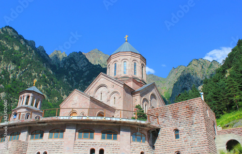 Georgian ortodox church in the middle of the mountains sunny day