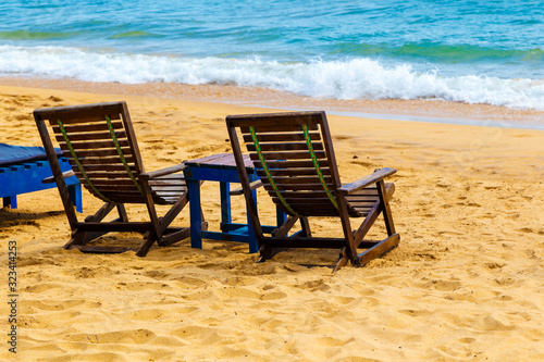 Two Beach Chairs on the beach Sri lanka. © vladimircaribb