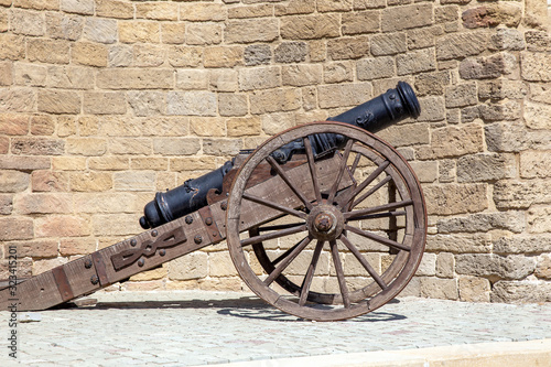 Ancient cannon near of the fortress wall of the Old City. Baku. Republic of Azerbaijan photo