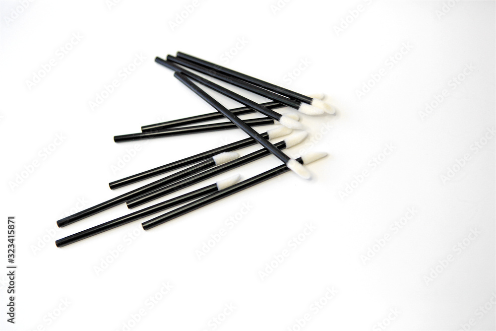 Disposable hygiene lipstick applicators on white background Disposable hygiene lipstick applicators on white background