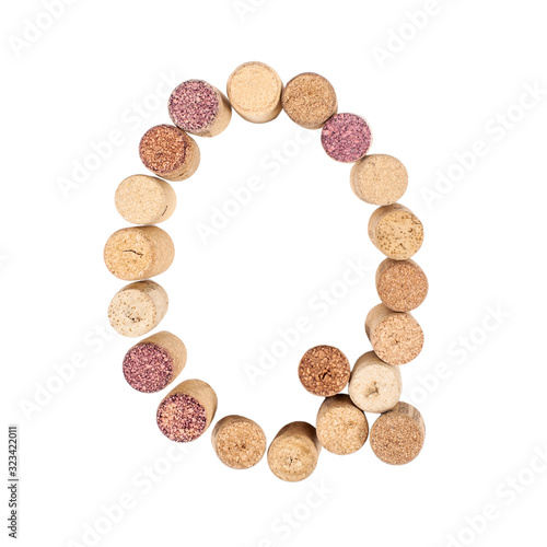 The letter "Q" is made of wine corks. Isolated on white background