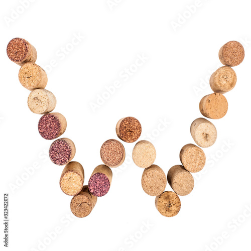 The letter "W" is made of wine corks. Isolated on white background