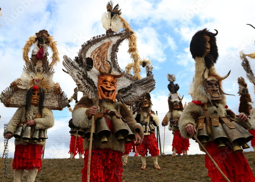 Elin Pelin, Bulgaria - February 15, 2020: Masquerade festival in Elin Pelin, Bulgaria. People with mask called Kukeri dance and perform to scare the evil spirits. photo