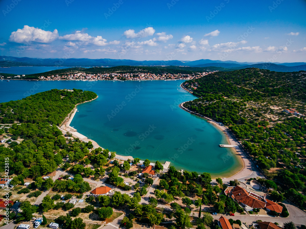 Aerial view of beautiful summer landscape with blue sea with yachts, green hills and old town in Croatia