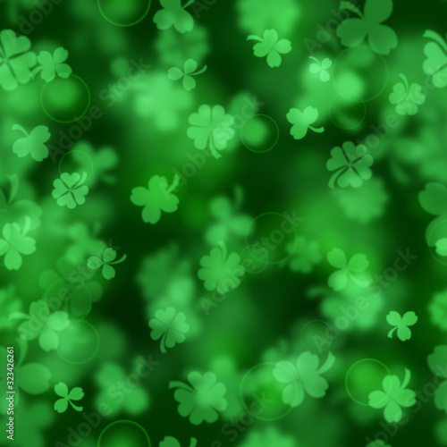 Seamless pattern on St. Patrick's Day made of blurry clover leaves in green colors