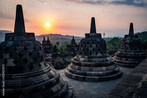 sunset at borobudur with stupas