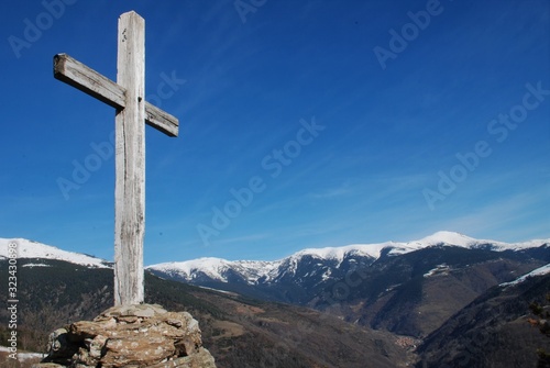 Wooden cross on top of mountain