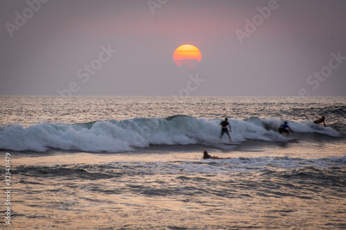 Photography people are surfing during sunset