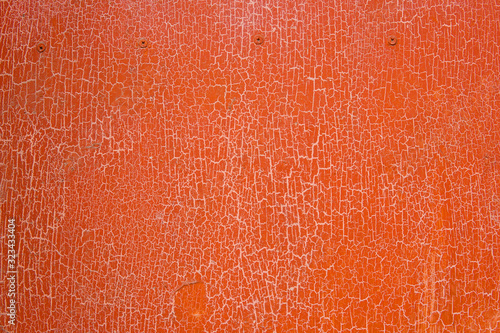 Red orange texture. Crack of old paint. Surface is destroyed by time.