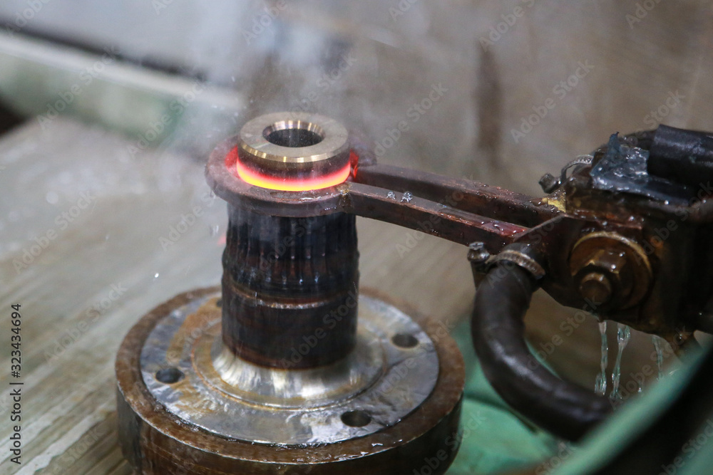 Process of heating and cooling metal. Hardening of steel part in production. Process of heating and cooling metal. Hardening of steel part in production.