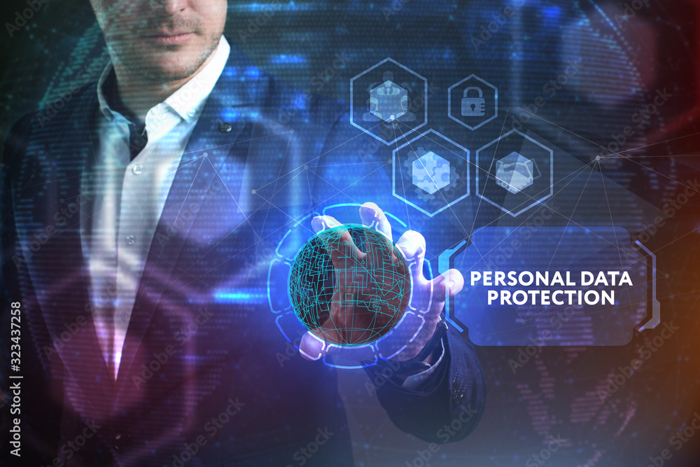 Business, Technology, Internet and network concept. Young businessman working on a virtual screen of the future and sees the inscription: Personal data protection Business, Technology, Internet and network concept. Young businessman working on a virtual screen of the future and sees the inscription: Personal data protection