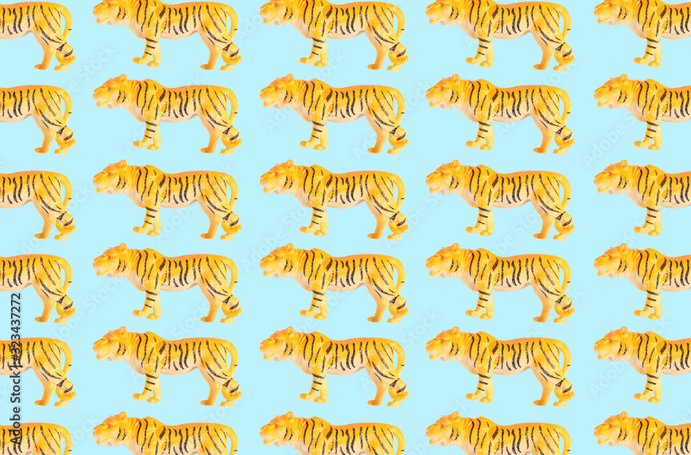 Group of plastic tiger doll isolated on color background Group of plastic tiger doll isolated on color background