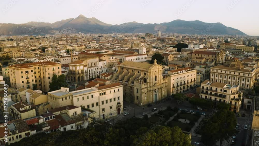Cinematic flying on an early sunny morning over an old Baroque Church's in the historic part of Palermo. Aerial shoot Cinematic flying on an early sunny morning over an old Baroque Church's in the historic part of Palermo. Aerial shoot