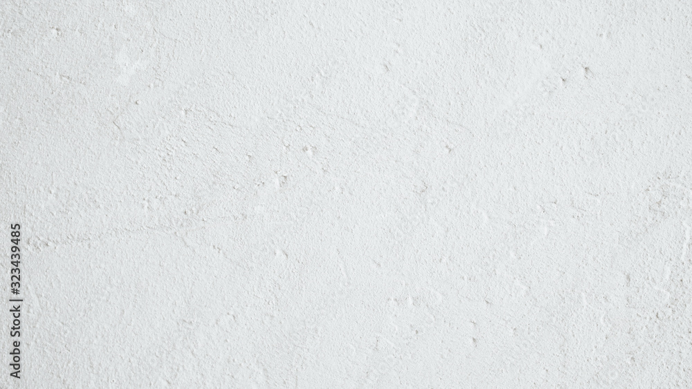 White background. Textured wall. Grainy plaster surface. White background. Textured wall. Grainy plaster surface.