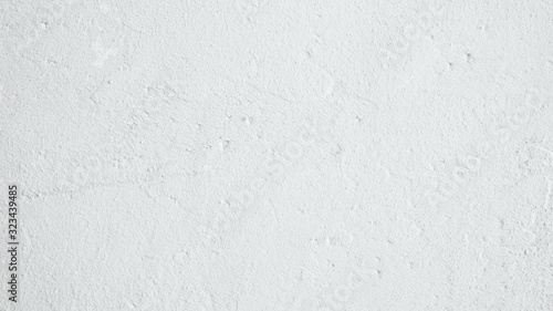 White background. Textured wall. Grainy plaster surface.