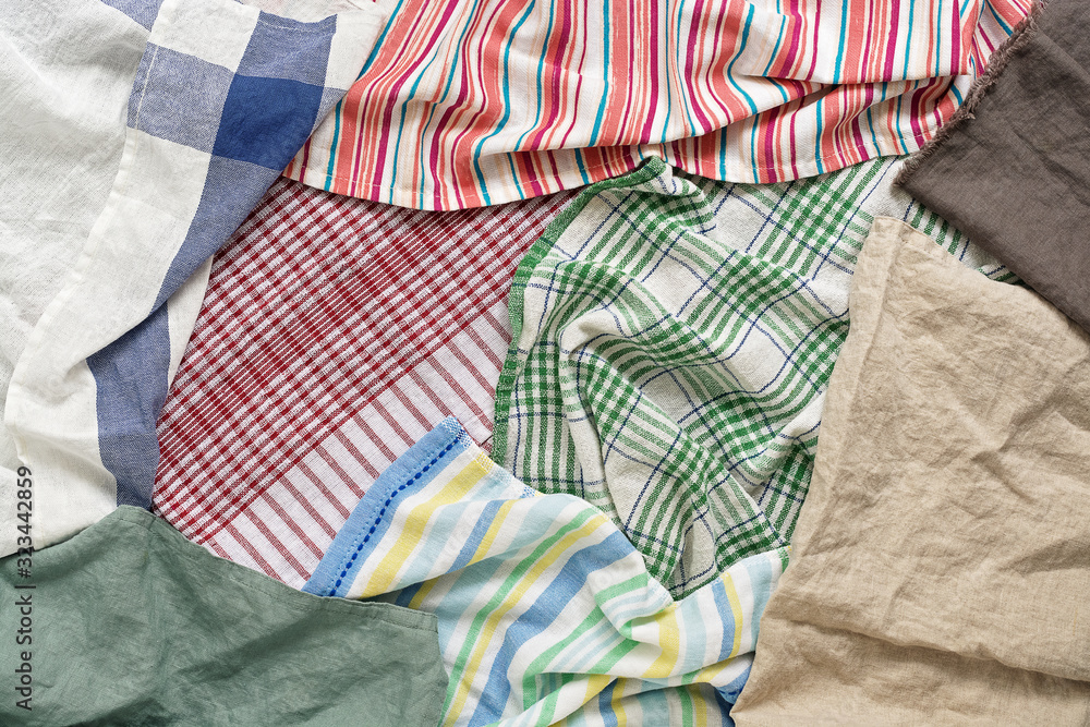 Background from kitchen towels and napkins, flat lay. View from above.