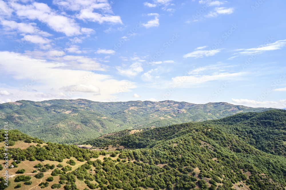 Fototapeta premium Legendary aerial drone view of ancient monasteries and breathtaking picturesque valley and landmark canyon of Meteora, Greece, Unesco