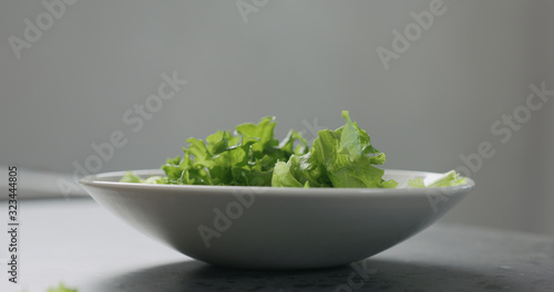frisee salad leaves in white bowl