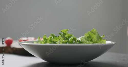 frisee salad leaves in white bowl