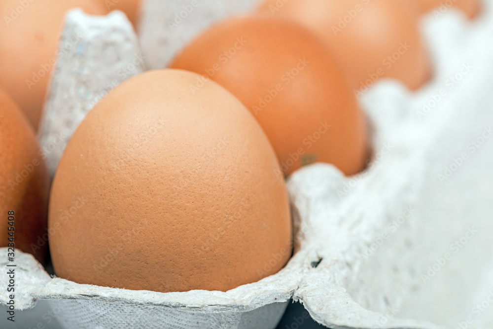 Brown eggs in the cardboard package macro Brown eggs in the cardboard package macro