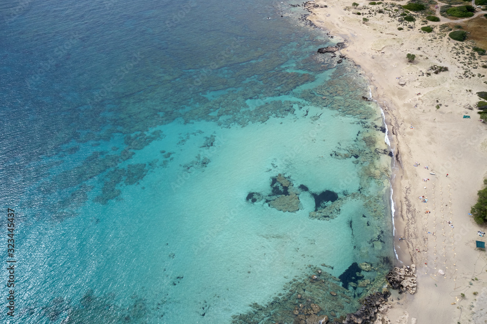 Aerial shot of beautiful turquoise beach Falasarna (Falassarna) in Crete, Greece. View of famous paradise sandy deep turquoise beach of Falasarna (Falassarna) in North West, Crete island, Greece.