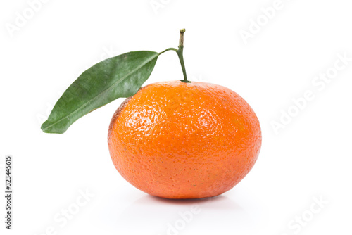 Single Tangerine clementine with green leaf isolated. Clipping path