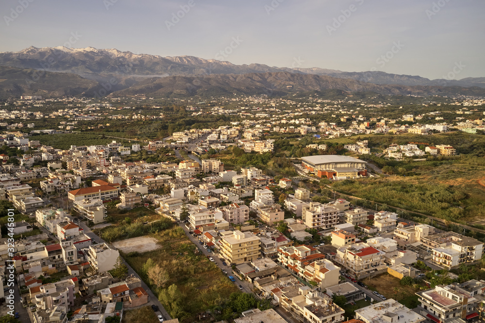 Panoramic aerial view from above of the city of Chania, Crete island, Greece with white mountains, beautiful venetian town Chania in Crete island. Chania, Crete, Greece.
