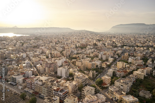 Panoramic aerial view from above of the city of Chania, Crete island, Greece with white mountains, beautiful venetian town Chania in Crete island. Chania, Crete, Greece.