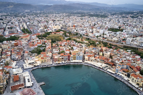 Panoramic drone aerial view from above of the city of Chania  Crete island  Greece. Landmarks of Greece  beautiful venetian town Chania in Crete island. Chania  Crete  Greece.