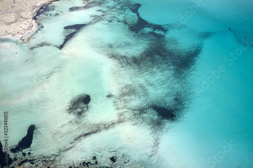 Amazing aerial drone top panoramic view on the famous Balos beach in Balos lagoon and pirate island Gramvousa. Place of the confluence of three seas. Balos beach, Chania. Crete island. Greece. Europe.