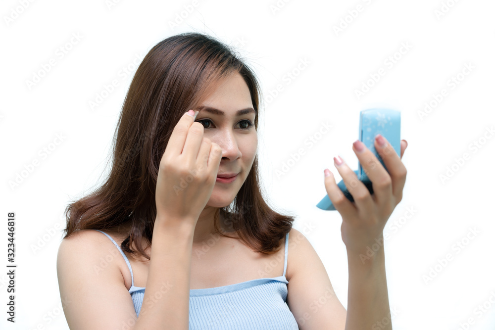 Healthy fresh girl use cosmetic to makeup her face. Beauty woman makeup her face with with cosmetic isolated on white background. Skin care and beauty concept. Healthy fresh girl use cosmetic to makeup her face. Beauty woman makeup her face with with cosmetic isolated on white background. Skin care and beauty concept.