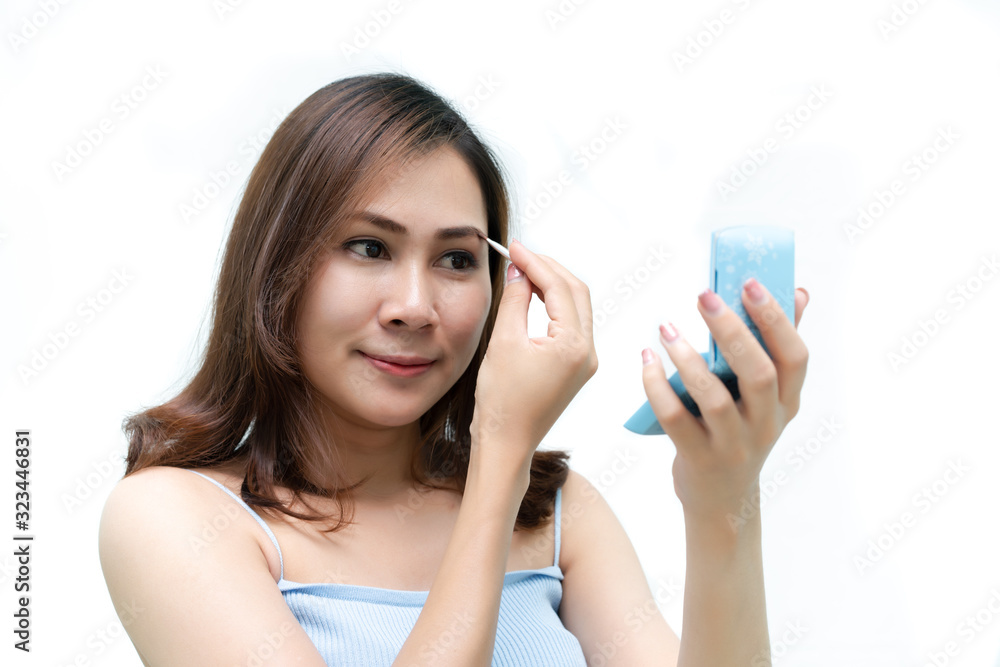 Healthy fresh girl use cosmetic to makeup her face. Beauty woman makeup her face with with cosmetic isolated on white background. Skin care and beauty concept. Healthy fresh girl use cosmetic to makeup her face. Beauty woman makeup her face with with cosmetic isolated on white background. Skin care and beauty concept.