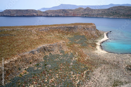 Aeial top view drone shot of Gramvousa island near Crete, Greece. Balos beach. Magical turquoise waters, lagoons, beaches of pure white sand photo