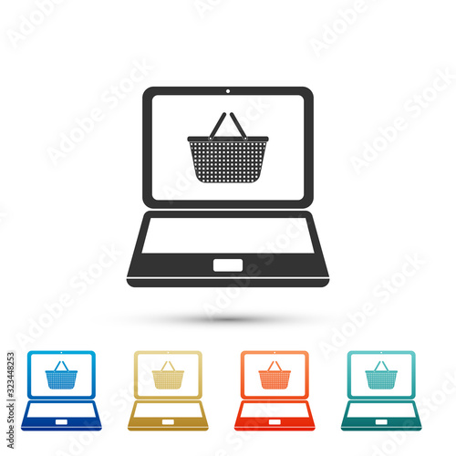 Black Shopping basket on screen laptop icon isolated on white background. Concept e-commerce, e-business, online business marketing. Color set icons. Vector Illustration