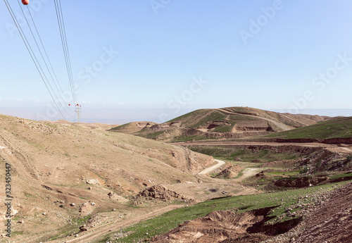 Panoramic view of the hills of Samaria with poles with high voltage power lines in Israel