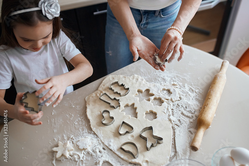 family working with cookie cutters. close up cropped photo. secret of successful cookery