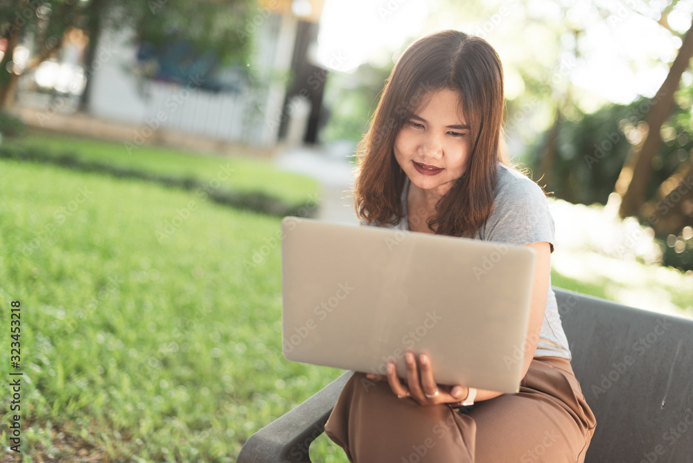 Asian freelance girl working with a laptop. Asian freelance girl working with a laptop.