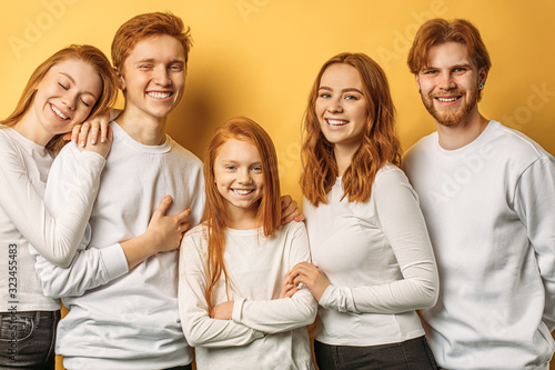 Fotografie, Obraz cool friendly group of caucasian people with red hair isolated in studio