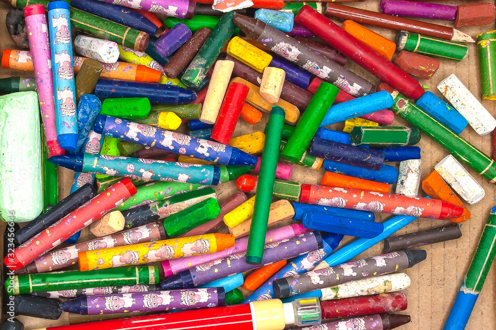 colored pencils and crayons in an open box