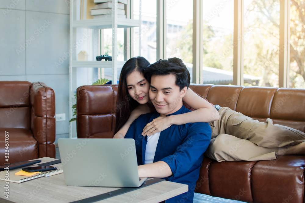 A couple is sitting in living room
