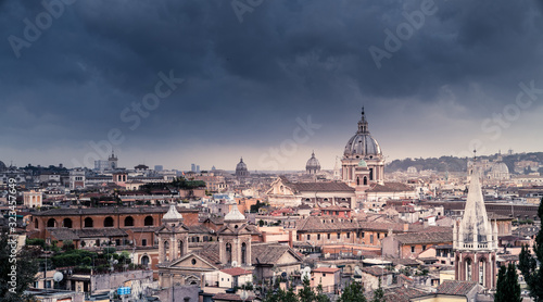 Rooftops of Rome under dramatic sky